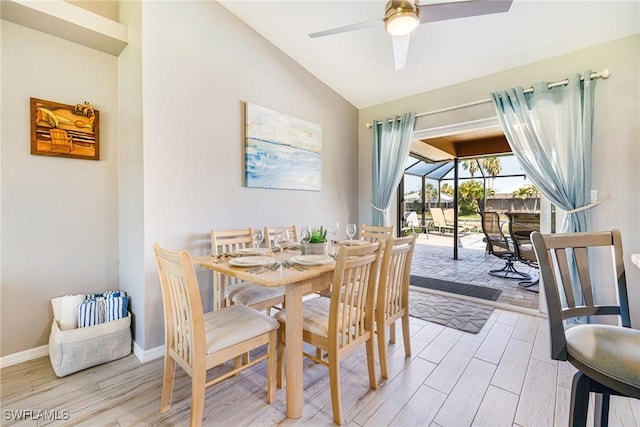 305 SW 8th St, Cape Coral, FL 33991 - dining space featuring light wood-style floors, lofted ceiling, a ceiling fan, and baseboards