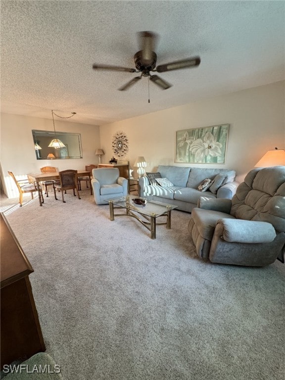 4103 SE 19th Ave Unit 206, Cape Coral, FL 33904 - carpeted living area featuring a textured ceiling and a ceiling fan