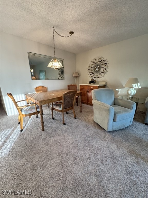 4103 SE 19th Ave Unit 206, Cape Coral, FL 33904 - dining room featuring carpet floors and a textured ceiling