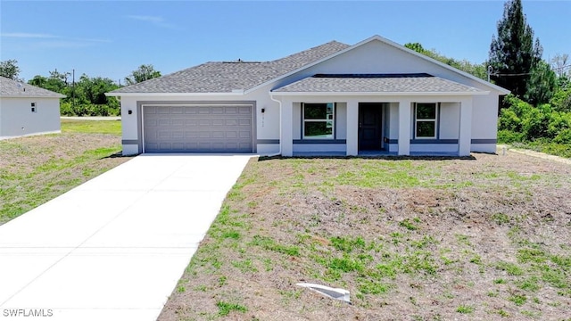 1962 Leghorn St, Lehigh Acres, FL 33972 - view of front of house featuring an attached garage, driveway, a porch, and stucco siding