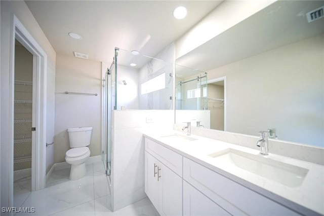 1962 Leghorn St, Lehigh Acres, FL 33972 - full bath featuring a shower stall, toilet, a walk in closet, double vanity, and recessed lighting