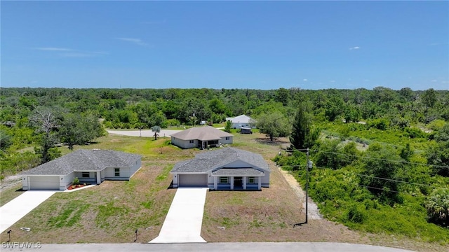 1962 Leghorn St, Lehigh Acres, FL 33972 - view from above of property featuring a heavily wooded area