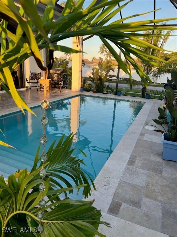 548 5th Ave, Marco Island, FL 34145 - swimming pool featuring a patio