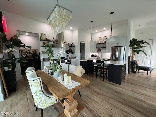 548 5th Ave, Marco Island, FL 34145 - dining room featuring light wood finished floors and recessed lighting
