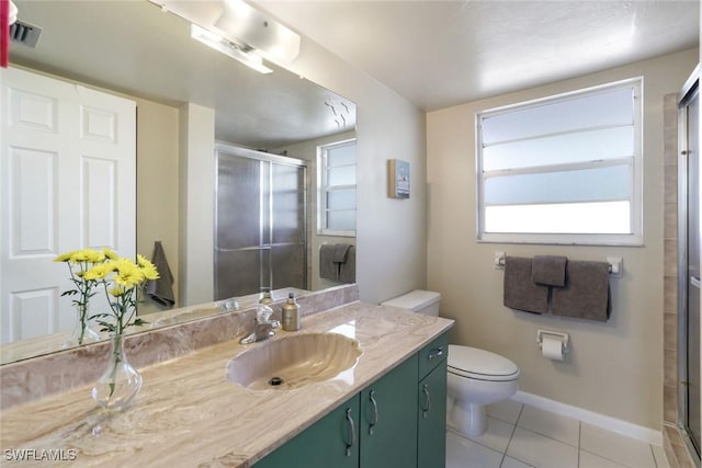 129 S Collier Blvd Unit B-206, Marco Island, FL 34145 - full bath featuring a stall shower, vanity, tile patterned floors, and toilet