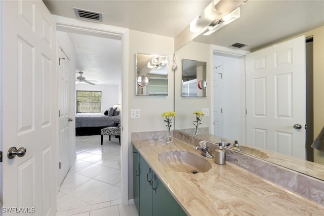 129 S Collier Blvd Unit B-206, Marco Island, FL 34145 - ensuite bathroom with tile patterned flooring, vanity, and ceiling fan