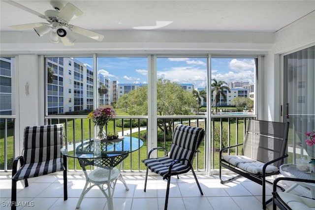129 S Collier Blvd Unit B-206, Marco Island, FL 34145 - sunroom featuring a ceiling fan, tile patterned floors, and healthy amount of natural light