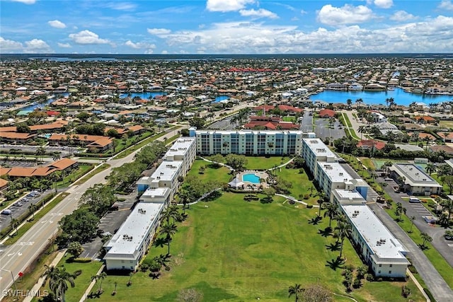 129 S Collier Blvd Unit B-206, Marco Island, FL 34145 - aerial perspective of suburban area with a nearby body of water and apartment complex / building