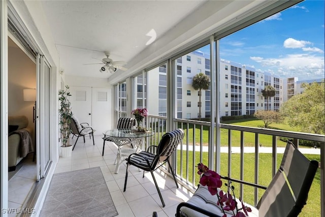 129 S Collier Blvd Unit B-206, Marco Island, FL 34145 - sunroom featuring ceiling fan