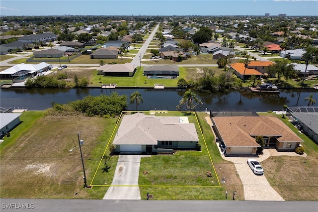 132 SW 34th Ln, Cape Coral, FL 33914 - aerial perspective of suburban area featuring a large body of water and property boundaries highlighted