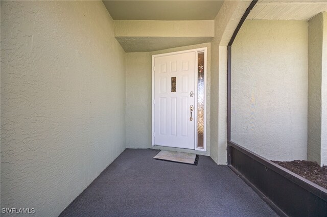 132 SW 34th Ln, Cape Coral, FL 33914 - view of exterior entry with stucco siding