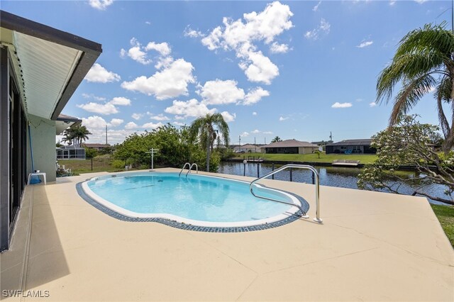 132 SW 34th Ln, Cape Coral, FL 33914 - outdoor pool with a water view and a patio area