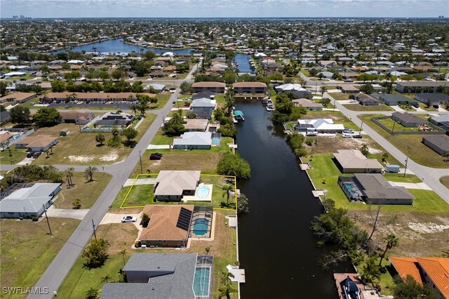 132 SW 34th Ln, Cape Coral, FL 33914 - aerial view of property's location featuring a large body of water and nearby suburban area