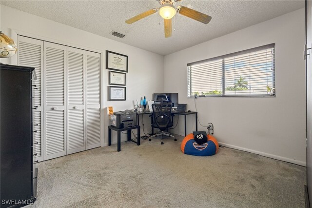 132 SW 34th Ln, Cape Coral, FL 33914 - carpeted office with a textured ceiling, ceiling fan, and baseboards