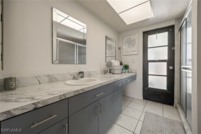132 SW 34th Ln, Cape Coral, FL 33914 - full bath with vanity, tile patterned floors, and a shower with shower door