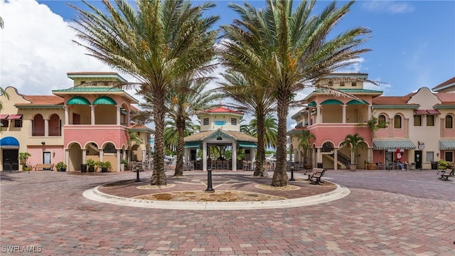 5781 Cape Harbour Dr Unit 1308, Cape Coral, FL 33914 - view of building exterior with curved driveway