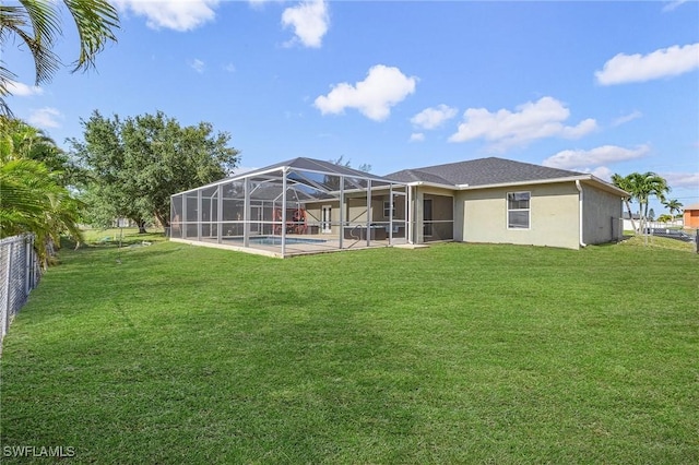 1233 NW 26th Pl, Cape Coral, FL 33993 - rear view of house featuring an outdoor pool, stucco siding, glass enclosure, and a patio
