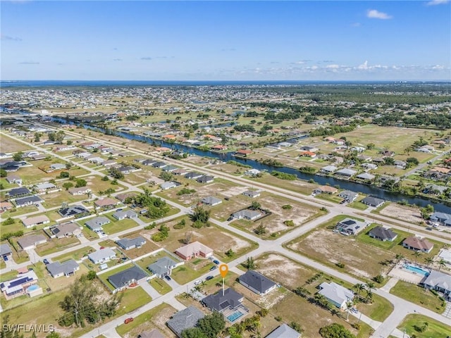 1233 NW 26th Pl, Cape Coral, FL 33993 - view of property location with nearby suburban area and a large body of water