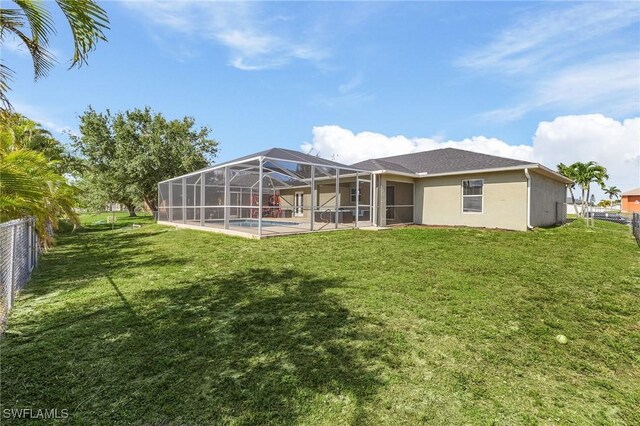 1233 NW 26th Pl, Cape Coral, FL 33993 - back of property with stucco siding, an outdoor pool, glass enclosure, and a patio area