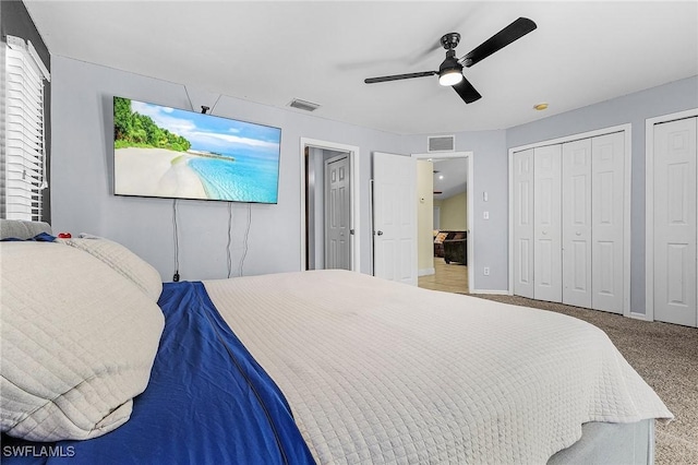 1233 NW 26th Pl, Cape Coral, FL 33993 - carpeted bedroom with multiple closets, a ceiling fan, and baseboards
