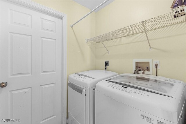 1233 NW 26th Pl, Cape Coral, FL 33993 - washroom featuring washer and clothes dryer