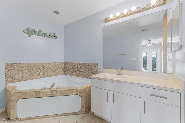 1233 NW 26th Pl, Cape Coral, FL 33993 - bathroom with a bath, vanity, tile patterned flooring, and a ceiling fan