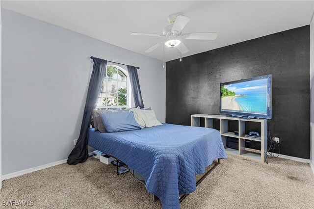 1233 NW 26th Pl, Cape Coral, FL 33993 - carpeted bedroom with baseboards and ceiling fan