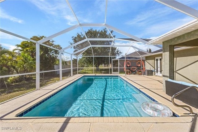1233 NW 26th Pl, Cape Coral, FL 33993 - swimming pool featuring a patio area and a lanai
