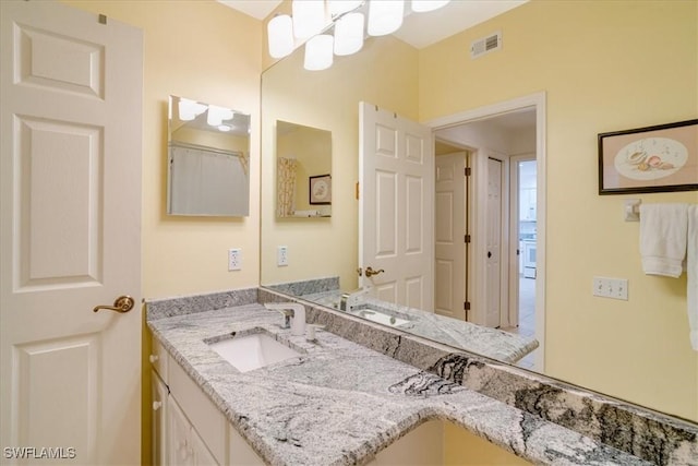17040 Willowcrest Way Unit 209, Fort Myers, FL 33908 - bathroom featuring vanity and a chandelier