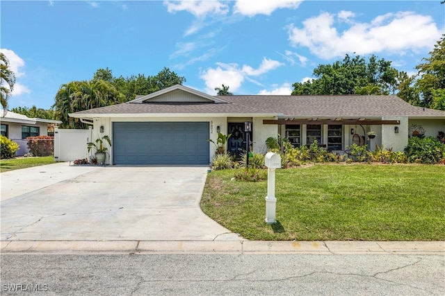 5692 Eichen Cir W, Fort Myers, FL 33919 - single story home featuring a garage, concrete driveway, stucco siding, and a shingled roof
