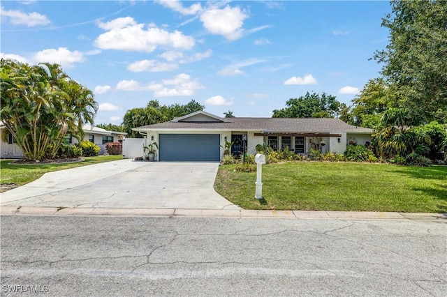 5692 Eichen Cir W, Fort Myers, FL 33919 - ranch-style house with a garage, a front lawn, concrete driveway, and stucco siding