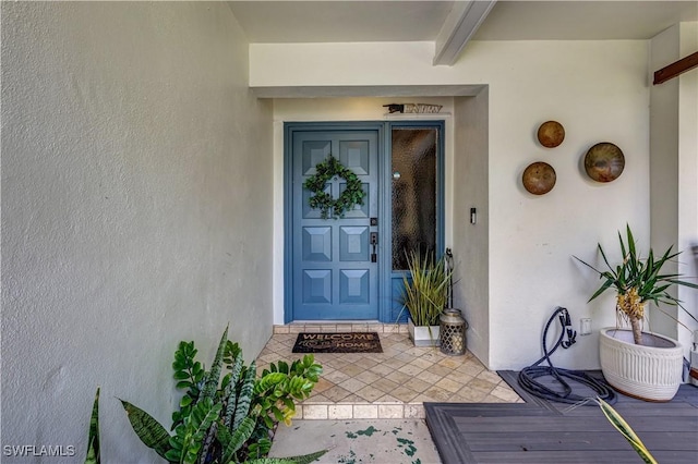 5692 Eichen Cir W, Fort Myers, FL 33919 - doorway to property with stucco siding