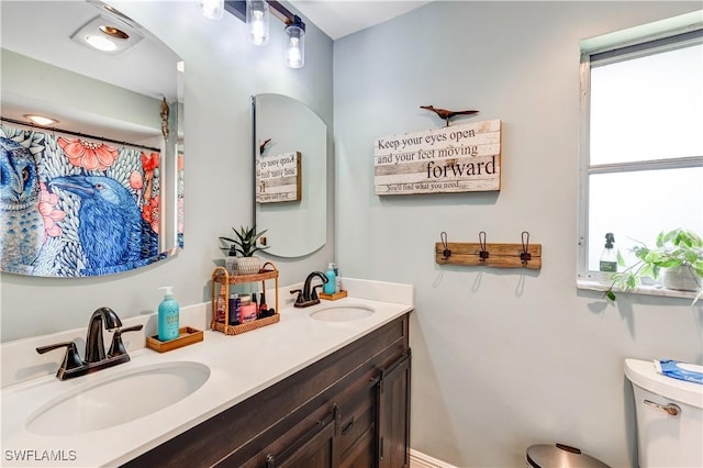 5692 Eichen Cir W, Fort Myers, FL 33919 - bathroom featuring double vanity and toilet