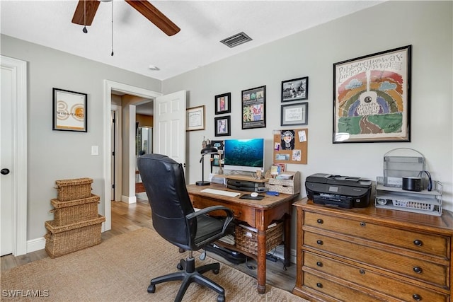 5692 Eichen Cir W, Fort Myers, FL 33919 - office area with wood finished floors, ceiling fan, and baseboards