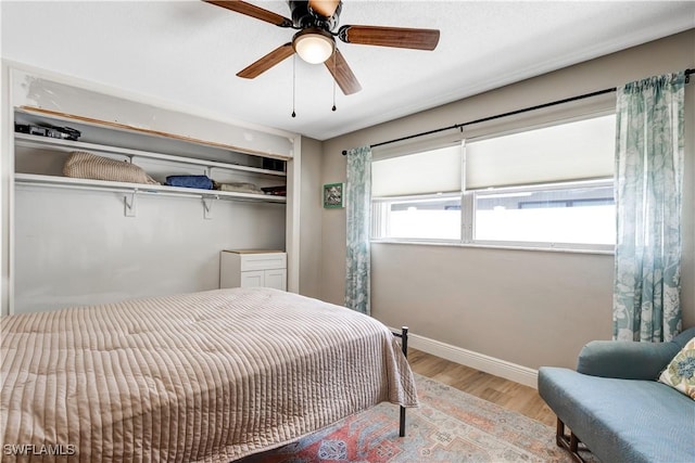 5692 Eichen Cir W, Fort Myers, FL 33919 - bedroom featuring wood finished floors, baseboards, a closet, and ceiling fan