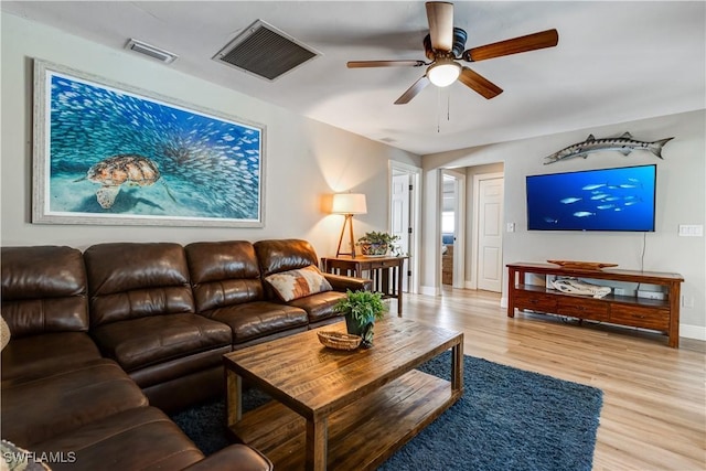 5692 Eichen Cir W, Fort Myers, FL 33919 - living area with ceiling fan, wood finished floors, and baseboards