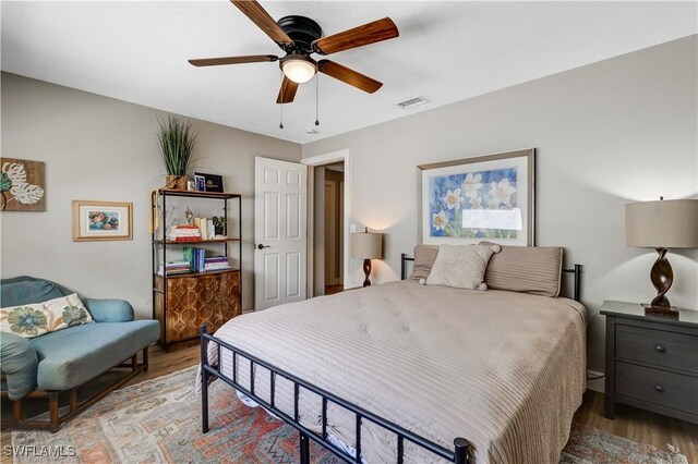 5692 Eichen Cir W, Fort Myers, FL 33919 - bedroom featuring wood finished floors and a ceiling fan