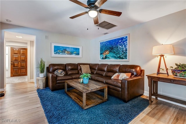 5692 Eichen Cir W, Fort Myers, FL 33919 - living room with ceiling fan, wood finished floors, and baseboards