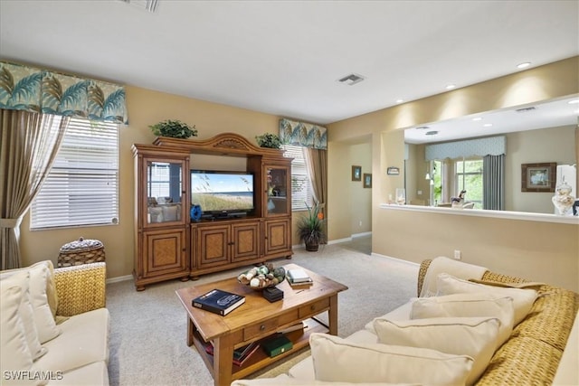 13180 SW Pembroke Cir, Lake Suzy, FL 34269 - carpeted living area with baseboards and recessed lighting
