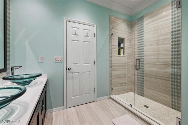 13180 SW Pembroke Cir, Lake Suzy, FL 34269 - full bathroom featuring a stall shower, double vanity, and baseboards