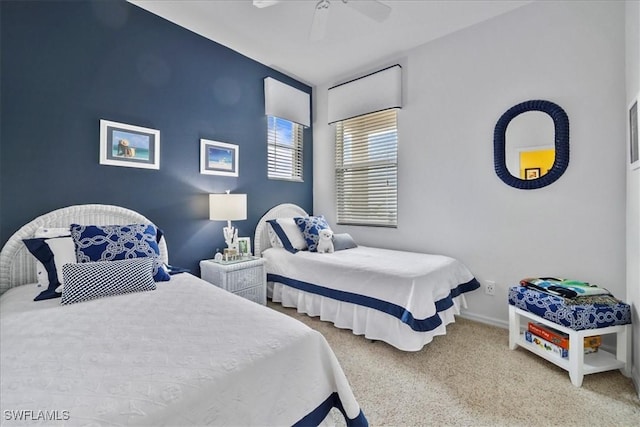 13180 SW Pembroke Cir, Lake Suzy, FL 34269 - bedroom with carpet, baseboards, and a ceiling fan