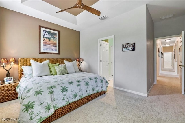 13180 SW Pembroke Cir, Lake Suzy, FL 34269 - bedroom featuring carpet flooring, baseboards, a tray ceiling, and ceiling fan