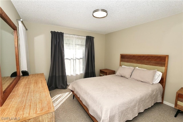 161 Wading Bird Cir Unit L202, Naples, FL 34110 - bedroom featuring carpet flooring and a textured ceiling