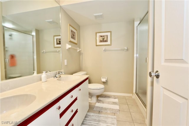 161 Wading Bird Cir Unit L202, Naples, FL 34110 - bathroom featuring toilet, tile patterned flooring, a stall shower, double vanity, and baseboards