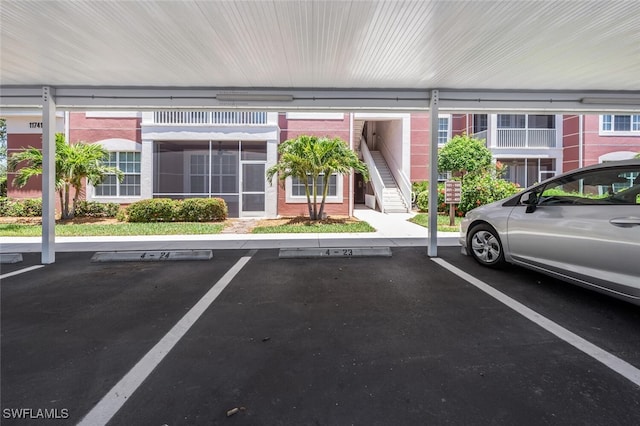 11741 Pasetto Ln Unit 403, Fort Myers, FL 33908 - covered parking lot with stairs