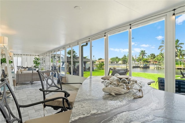 6212 Cocos Dr, Fort Myers, FL 33908 - sunroom featuring a water view