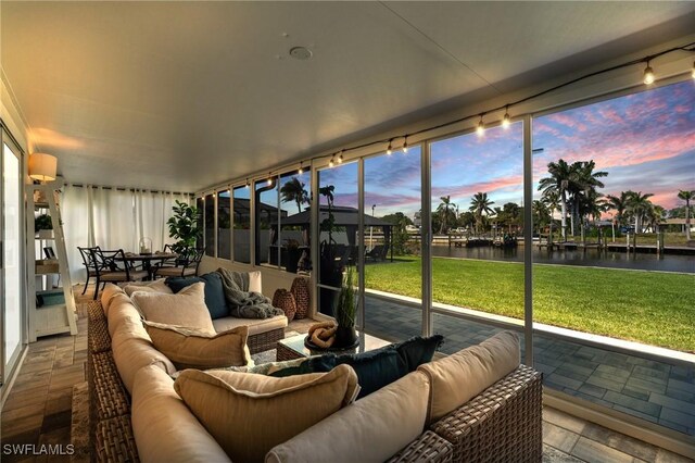 6212 Cocos Dr, Fort Myers, FL 33908 - sunroom featuring a water view, an outdoor hangout area, and rail lighting