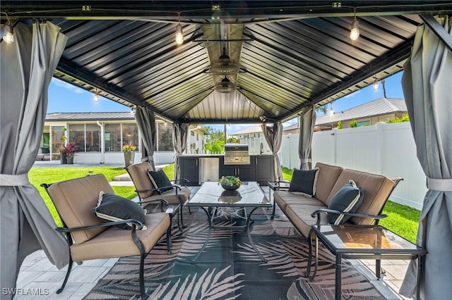 6212 Cocos Dr, Fort Myers, FL 33908 - view of patio / terrace with fence, an outdoor hangout area, a gazebo, an outdoor kitchen, and a sunroom