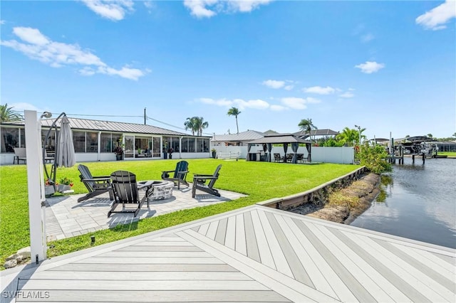 6212 Cocos Dr, Fort Myers, FL 33908 - rear view of house featuring an outdoor fire pit, a patio, a gazebo, a water view, and a standing seam roof