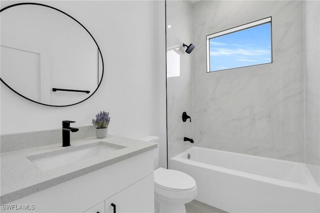 2003 Curry Ave N, Lehigh Acres, FL 33971 - full bathroom with toilet, vanity, and tub / shower combination